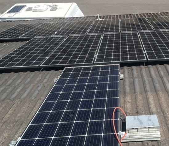 Same solar panels restored to clean dark finish after Barnzy panel wash