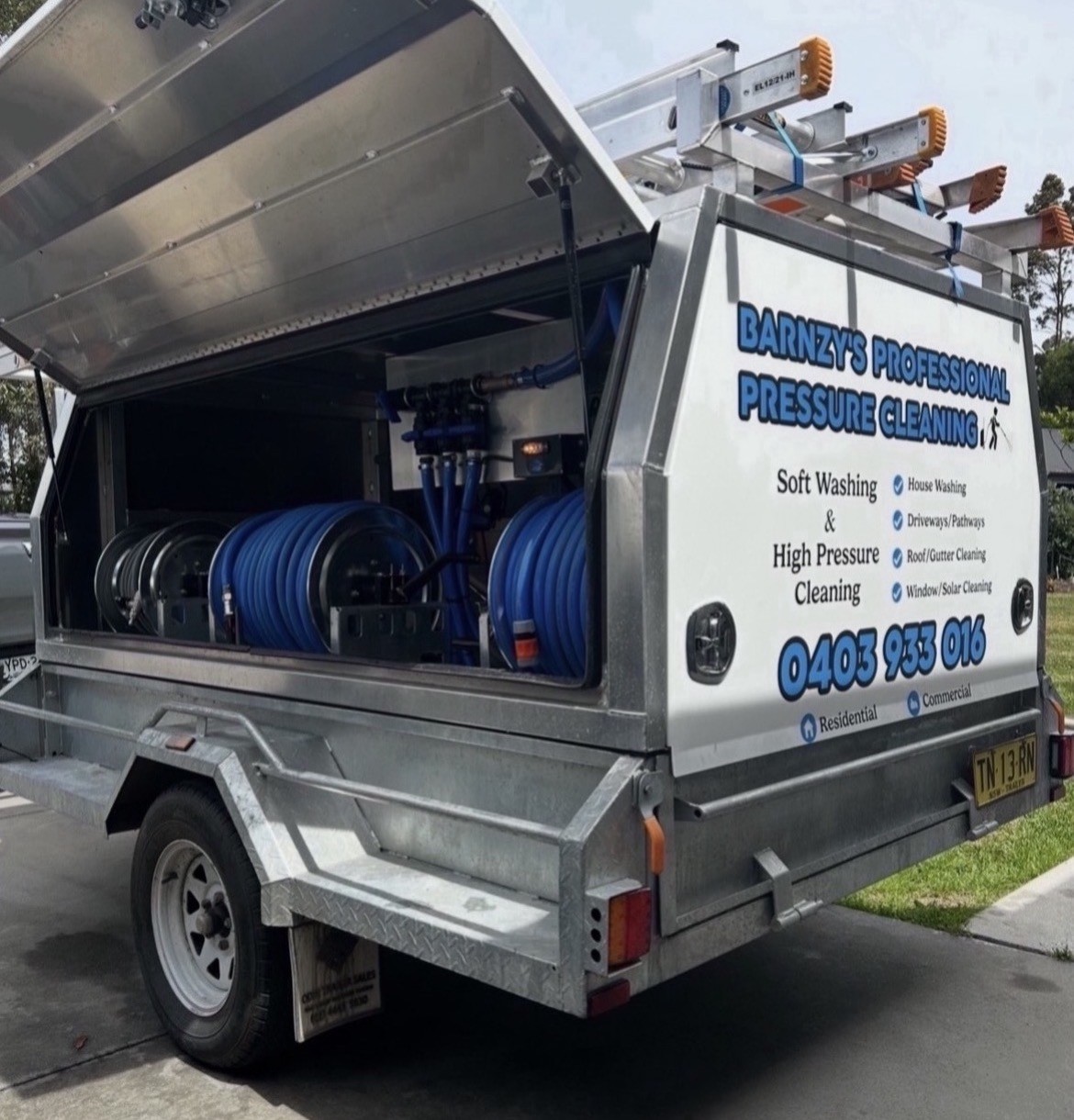 Barnzy's Professional Pressure Cleaning branded trailer with soft washing and high pressure equipment, hoses and reels