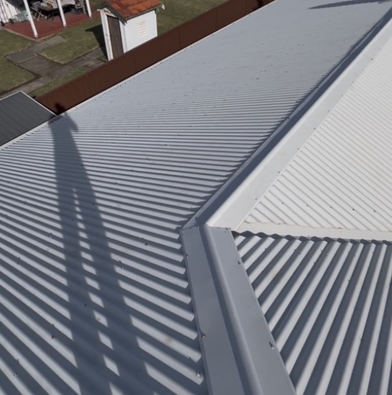 Same Colorbond roof restored to a clean grey finish after Barnzy soft wash